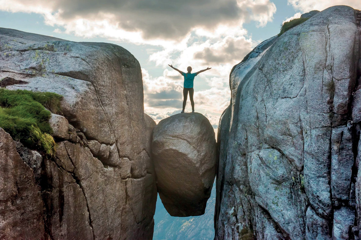 On the other side of the Lysefjord, another surprise awaits you! Kjeragbolt. This boulder suspended between cliffs at an altitude of 3,225 feet (984 meters) is not for the faint hearted